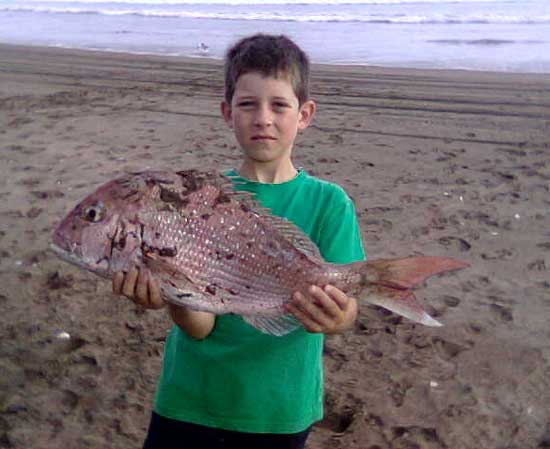 James with the biggest snapper taken on his fathers kite fishing rig